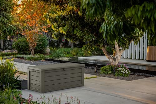keter westwood 150 gallon resin large outdoor storage shown in use