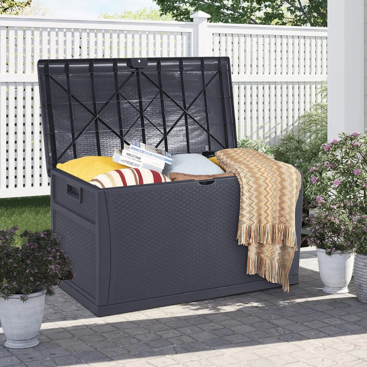 120 gallon resin wicker patio storage box, outdoor shown in use