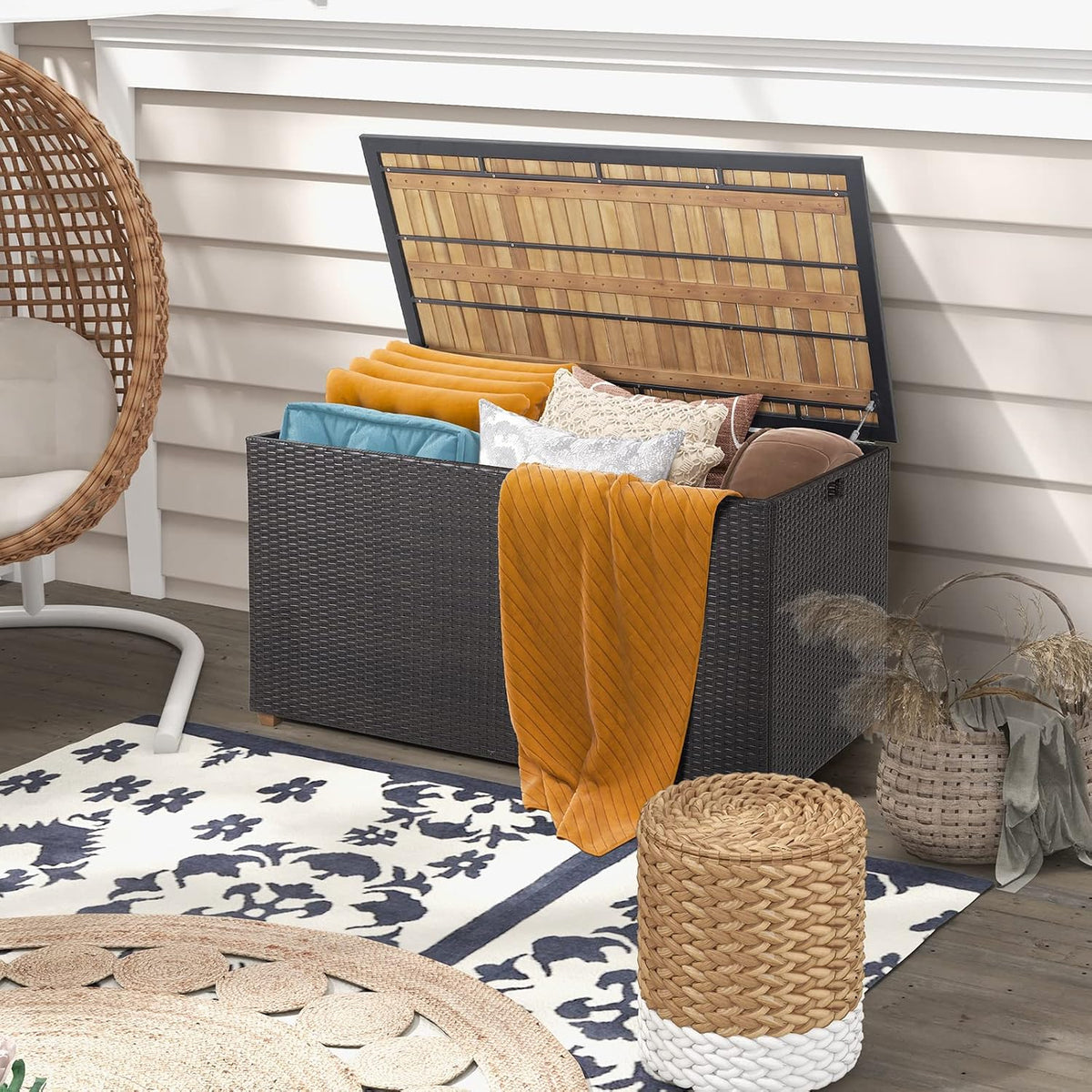 tangkula 134 gallon outdoor storage box, wicker patio shown in use