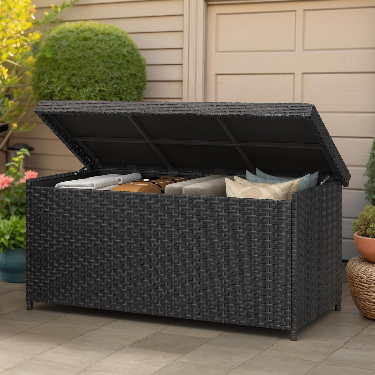 yitahome 260 gallon wicker deck box shown in use