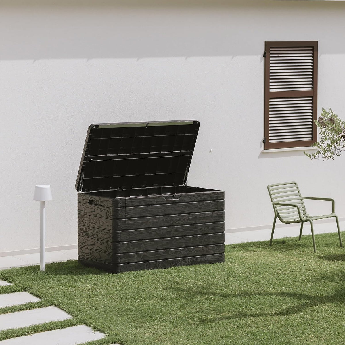 toomax dolomiti outdoor storage box, 970 litres, black on a desk or shelf